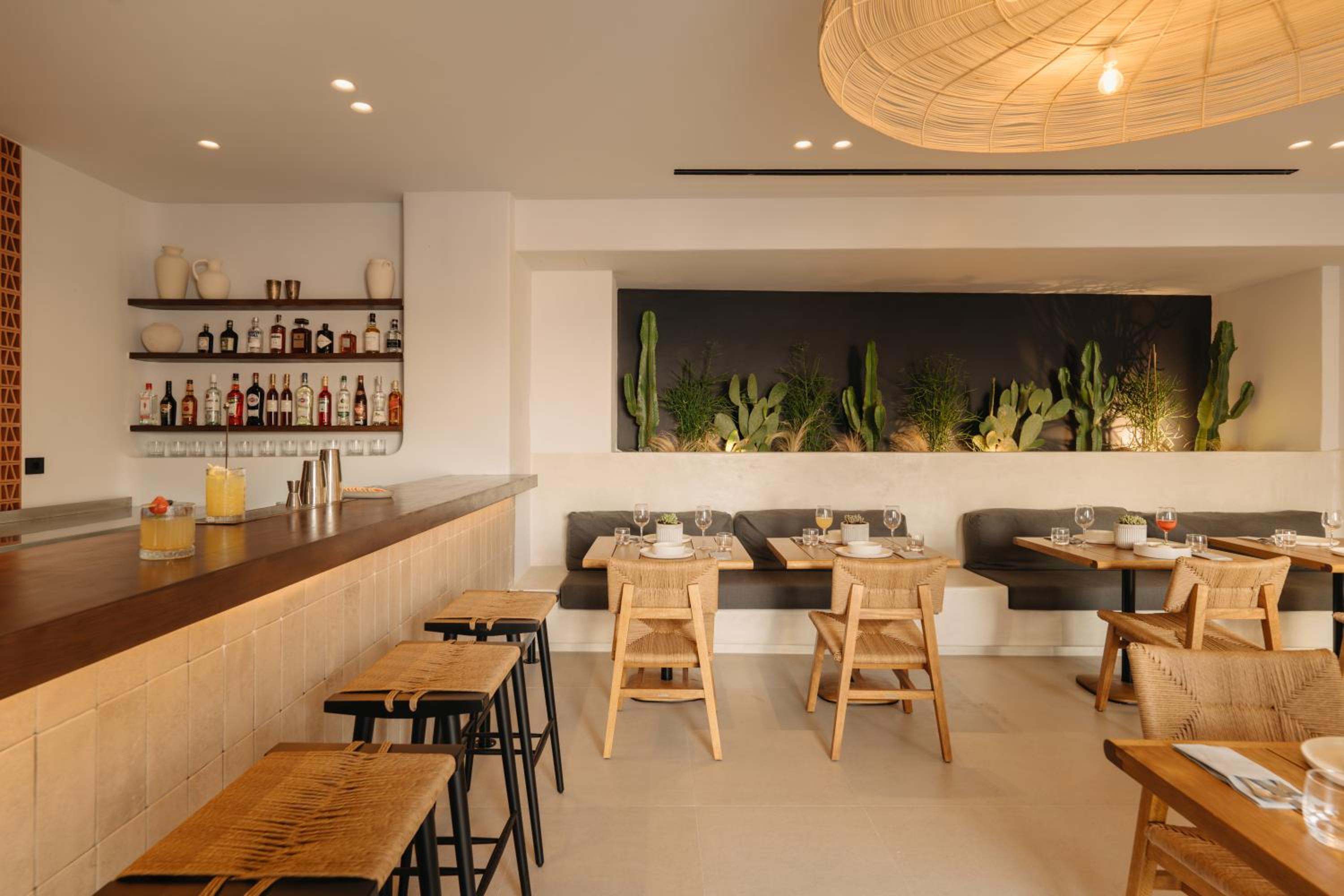 The bar, with stools along the counter and banquette seating