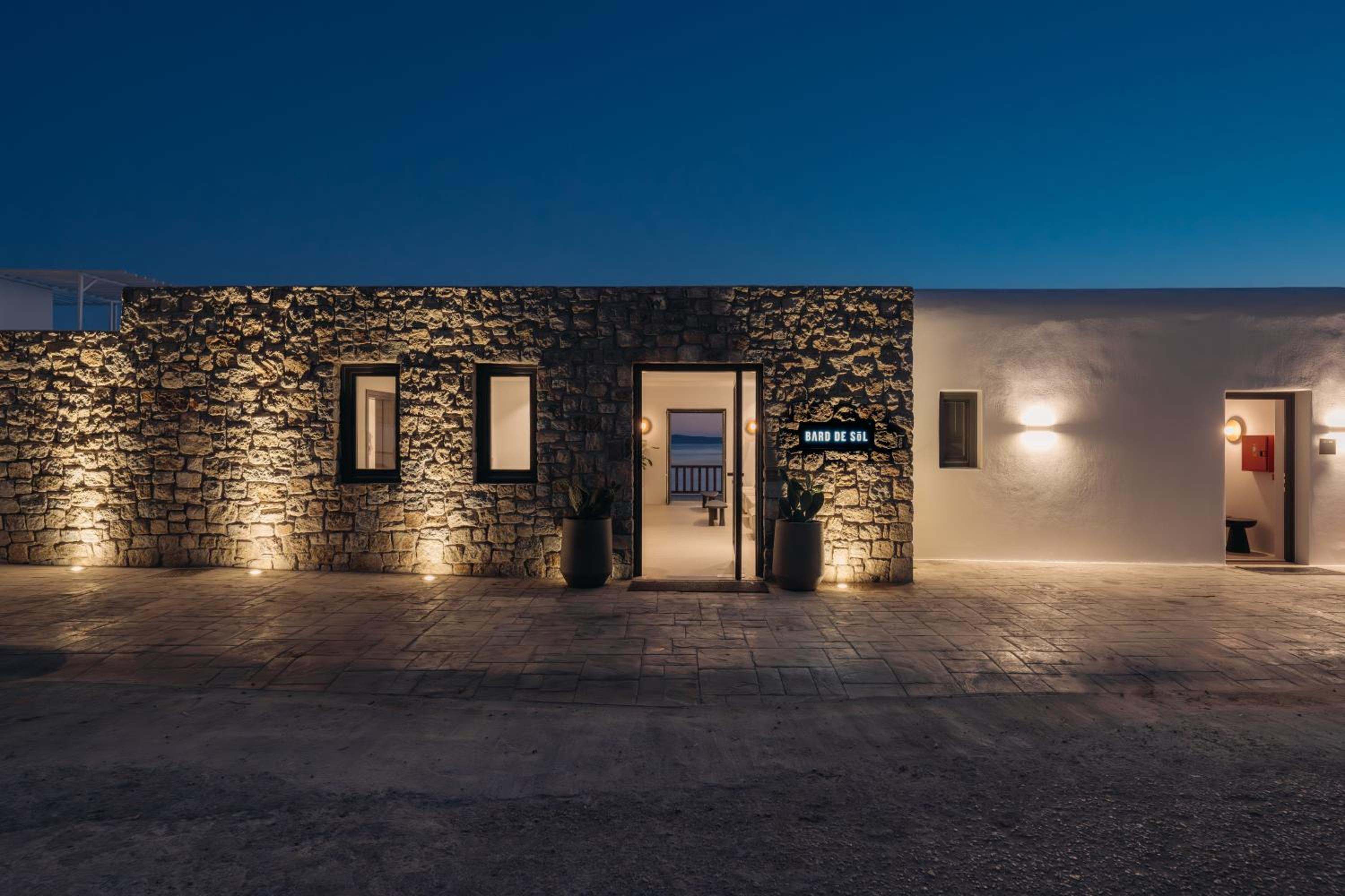 The stone entrance lit at dusk