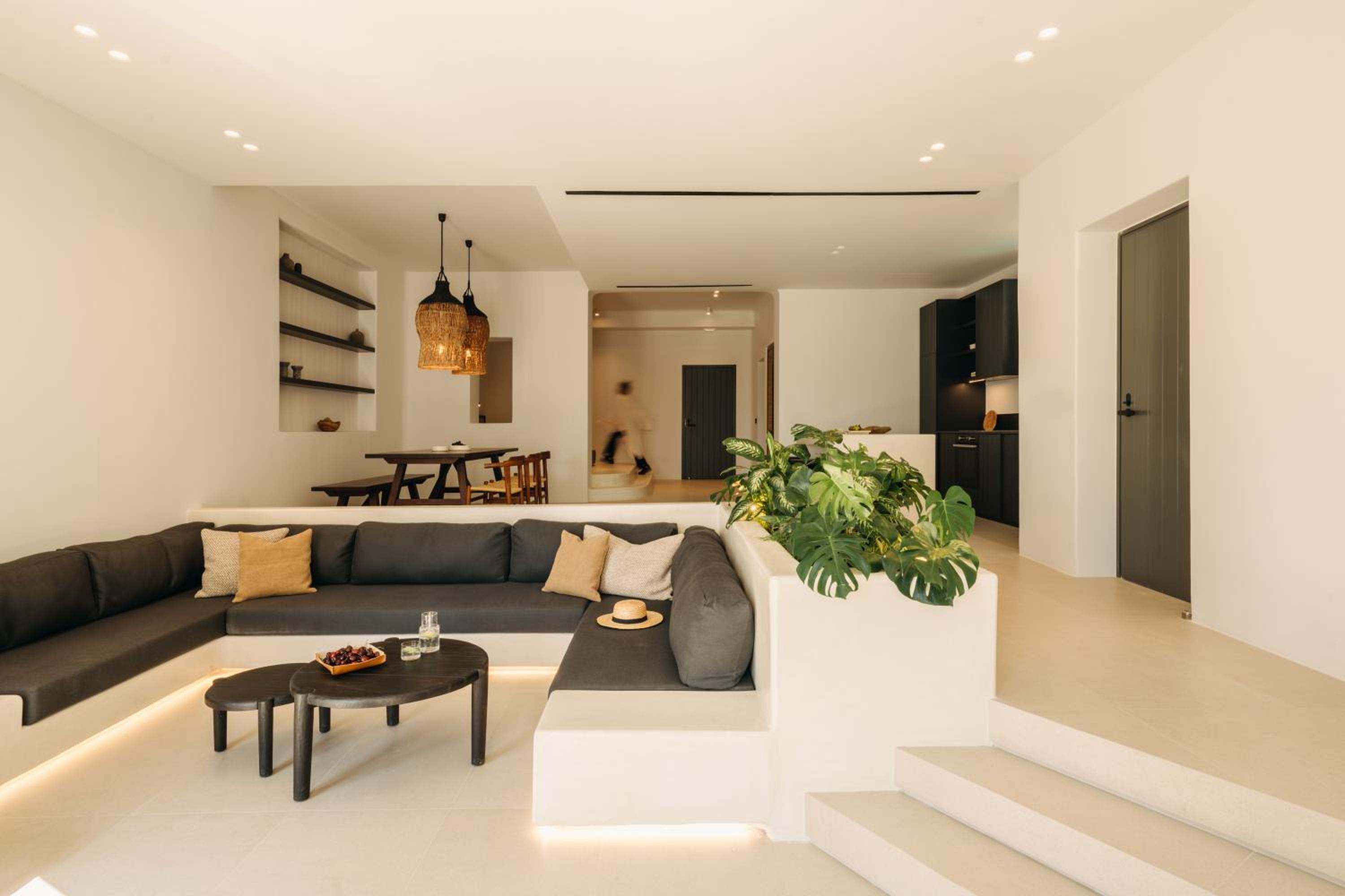 Del Sol Suite: the open-plan living room with a sunken sofa, dining table and kitchen