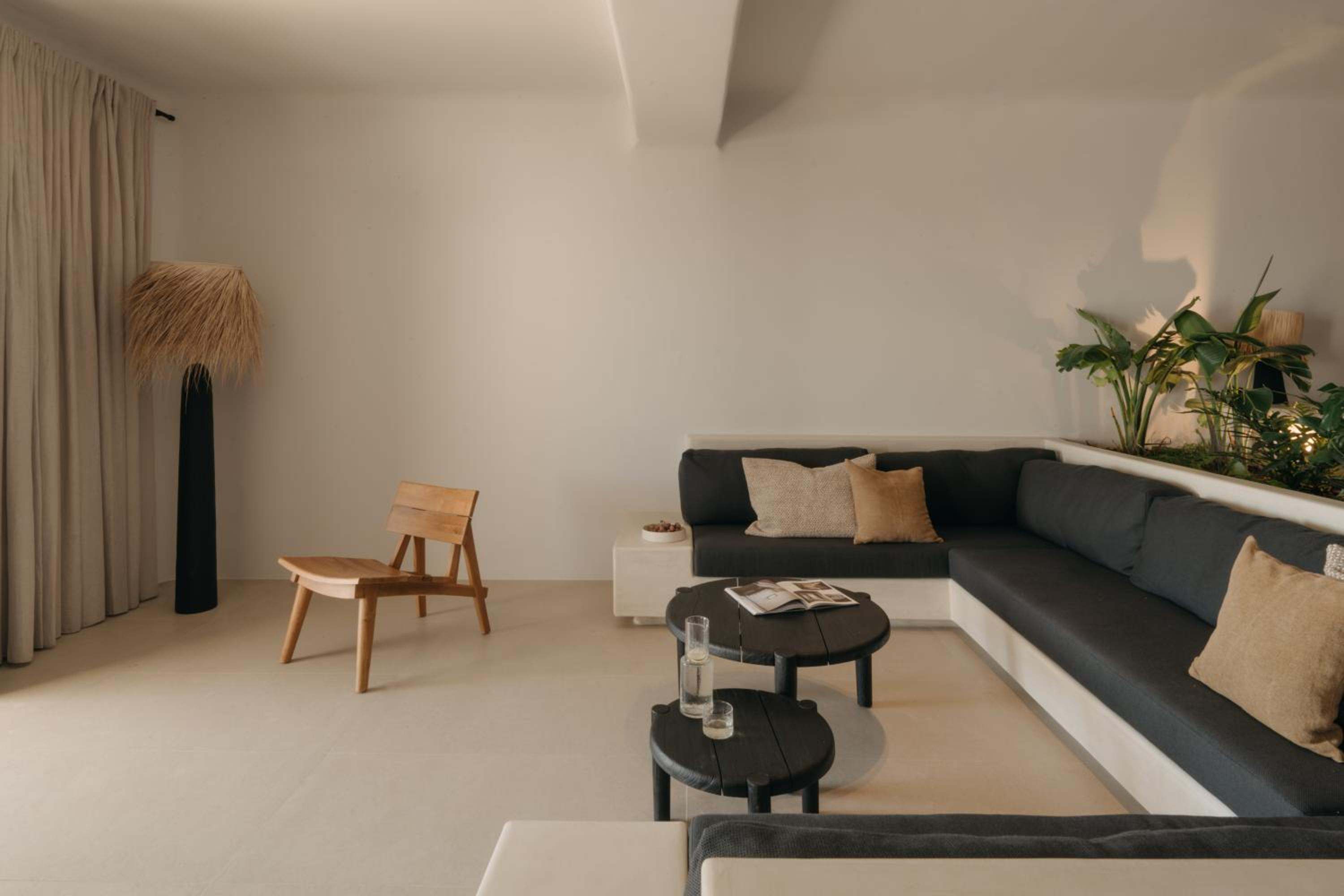 Premier Suite: the lounge, with a sunken sofa and a lounge chair