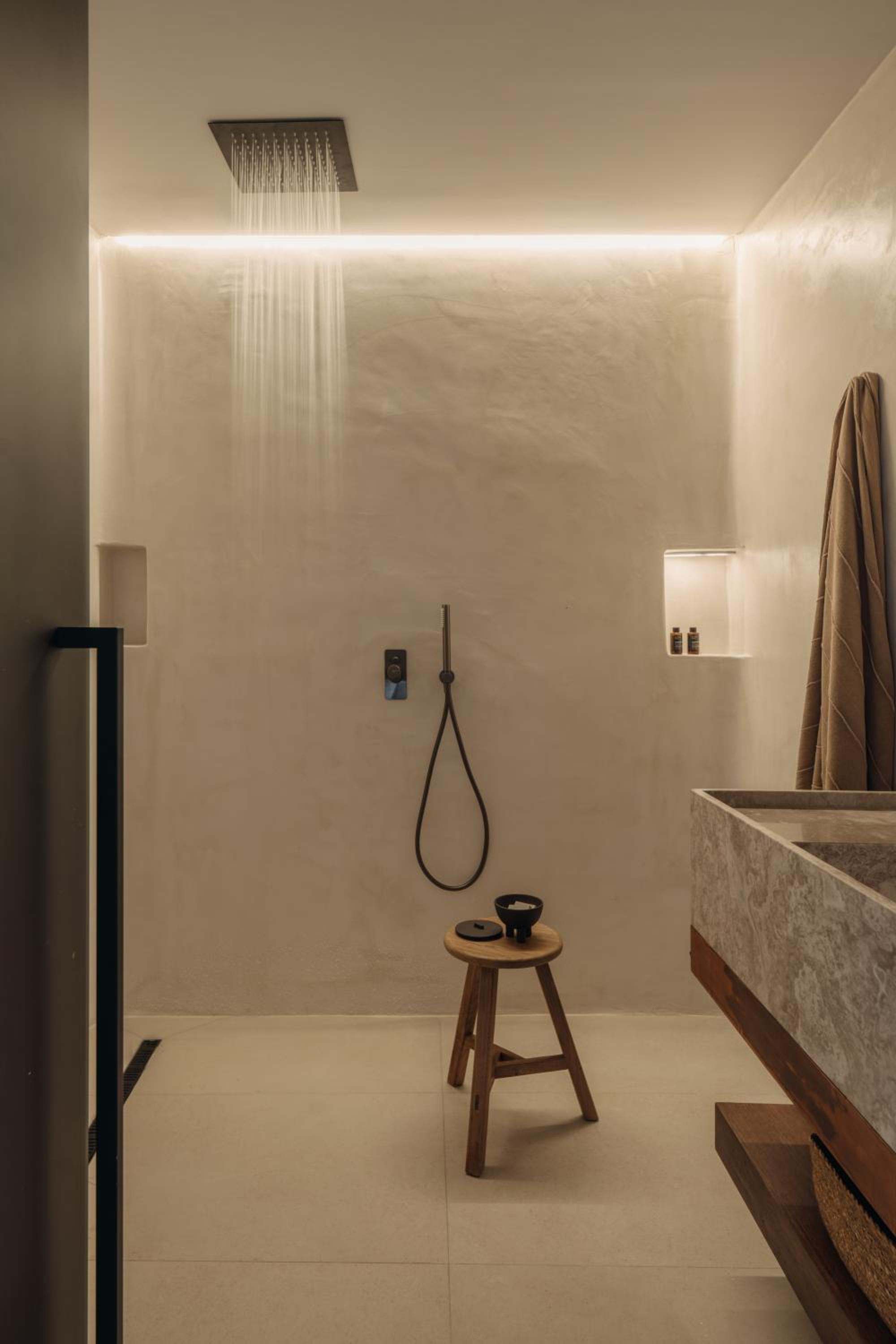 Premier Suite: a rain shower and a stone basin in the bathroom