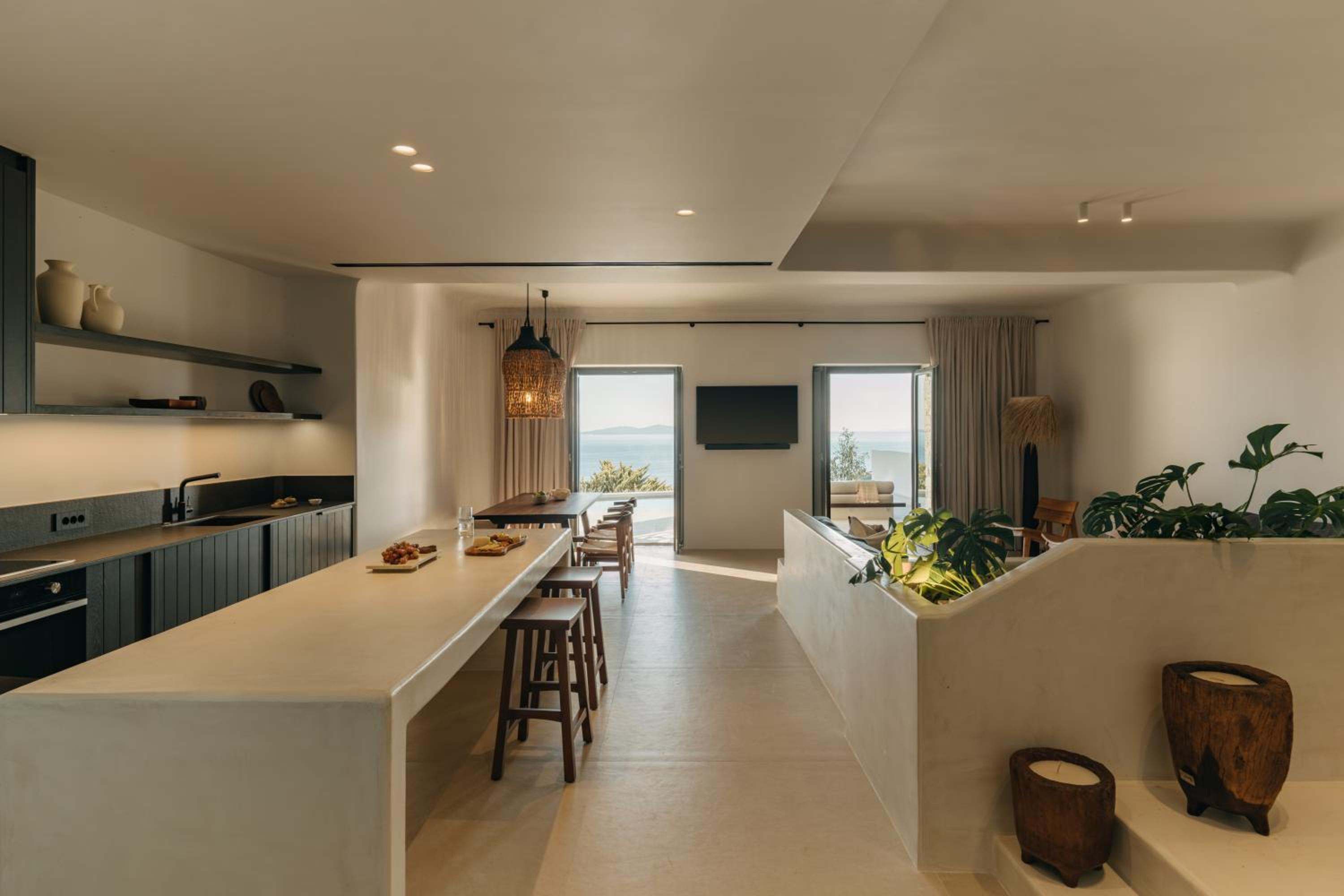 Premier Suite: the kitchen island and dining area, opening onto the terrace