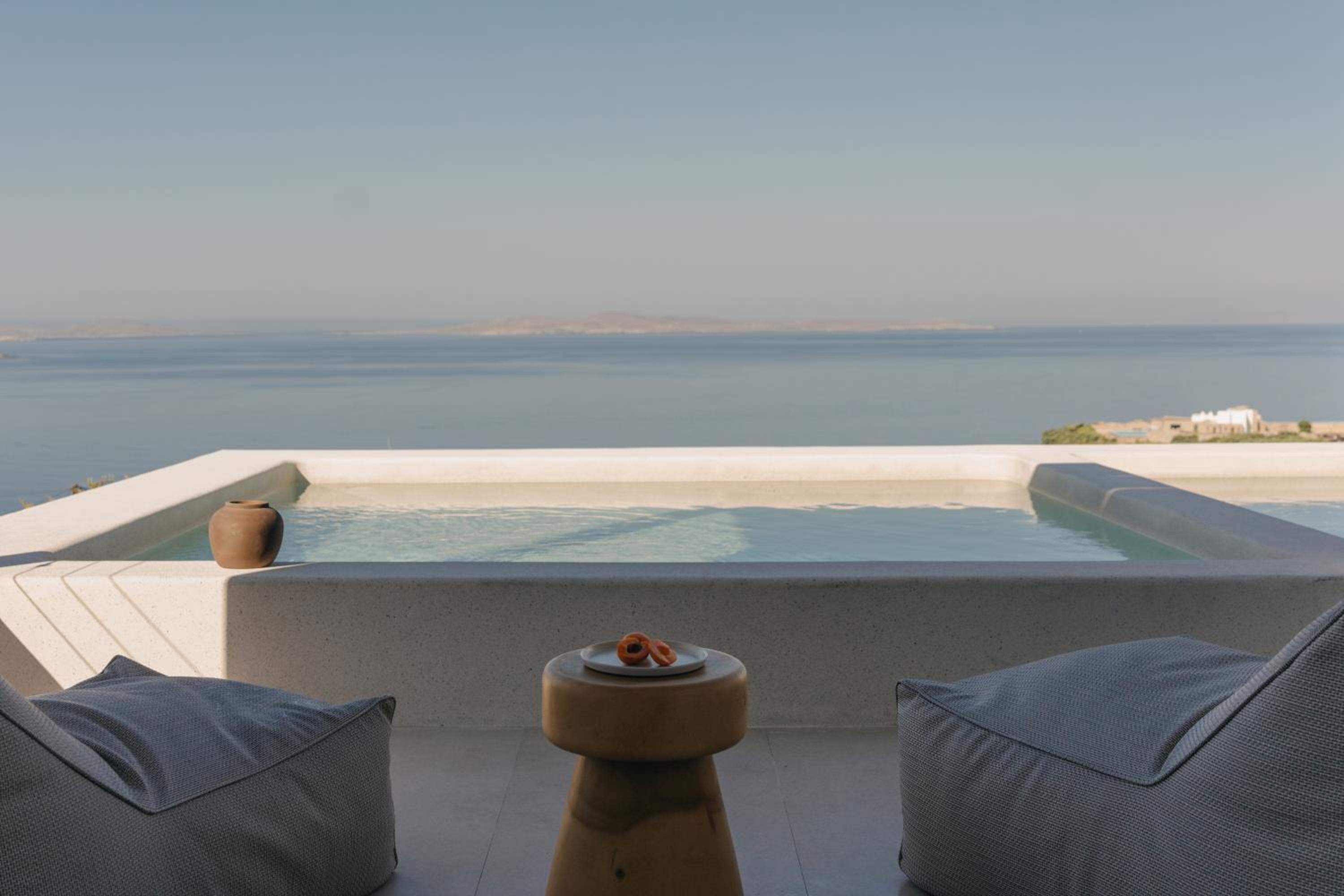 Junior Suite with Private Pool: the plunge pool and lounge cushions, facing the open sea