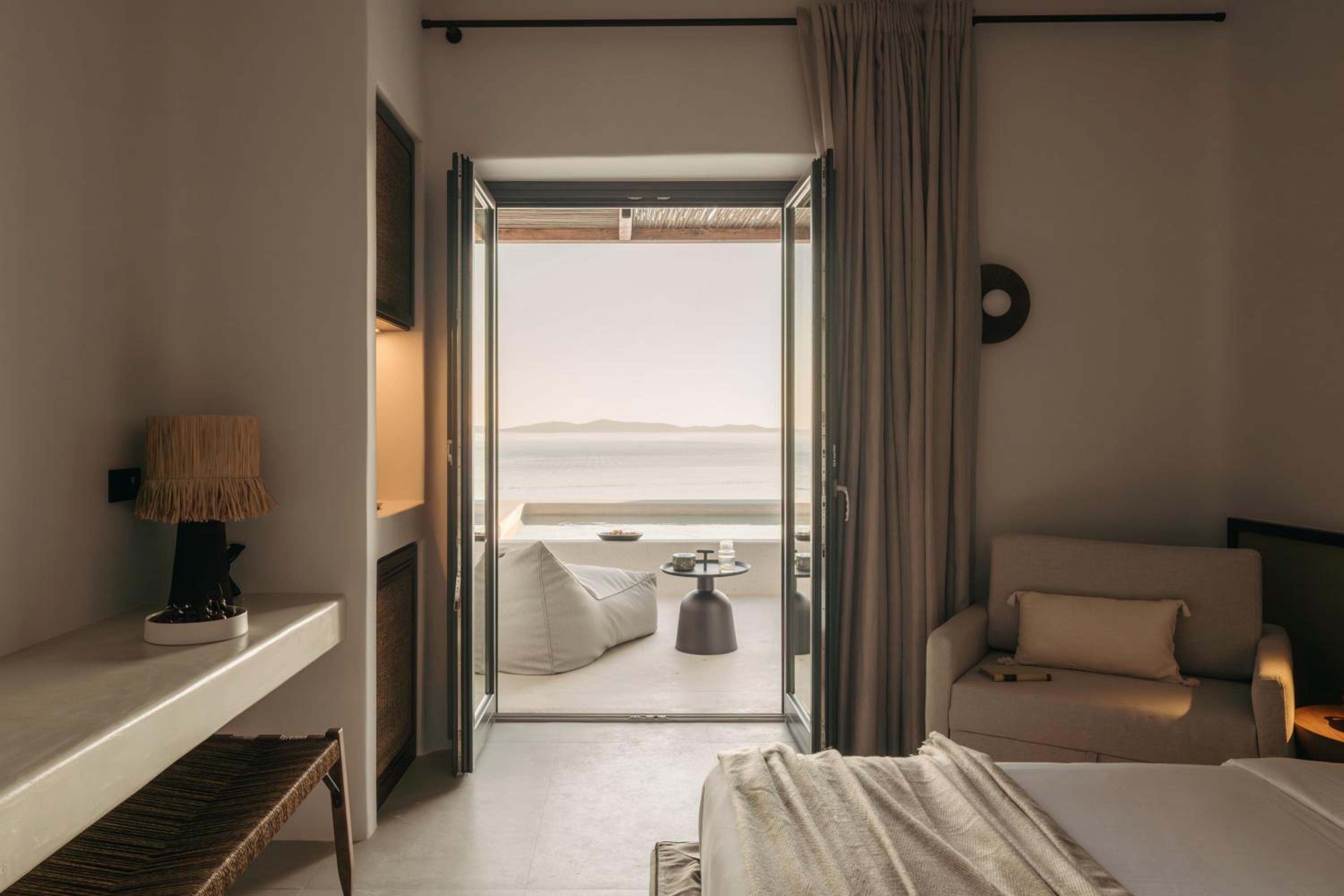 Junior Suite with Private Pool: the room, with doors open to the terrace